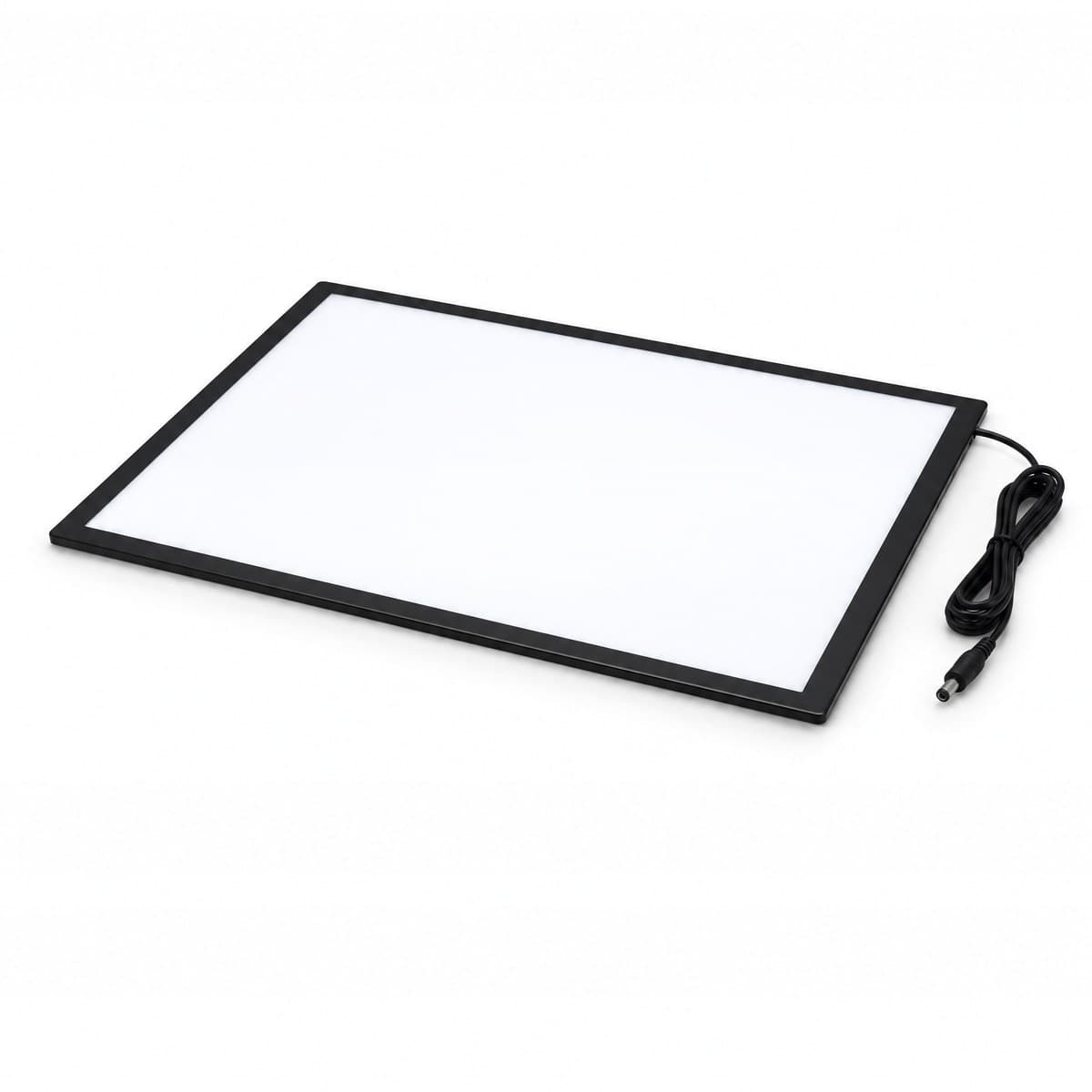 A thin A3 light pad with a lit white surface and a slim black border, its black power cable looped beside it and ending in a round plug